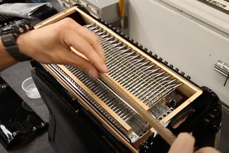 How to block bass chord mechanism for shipping